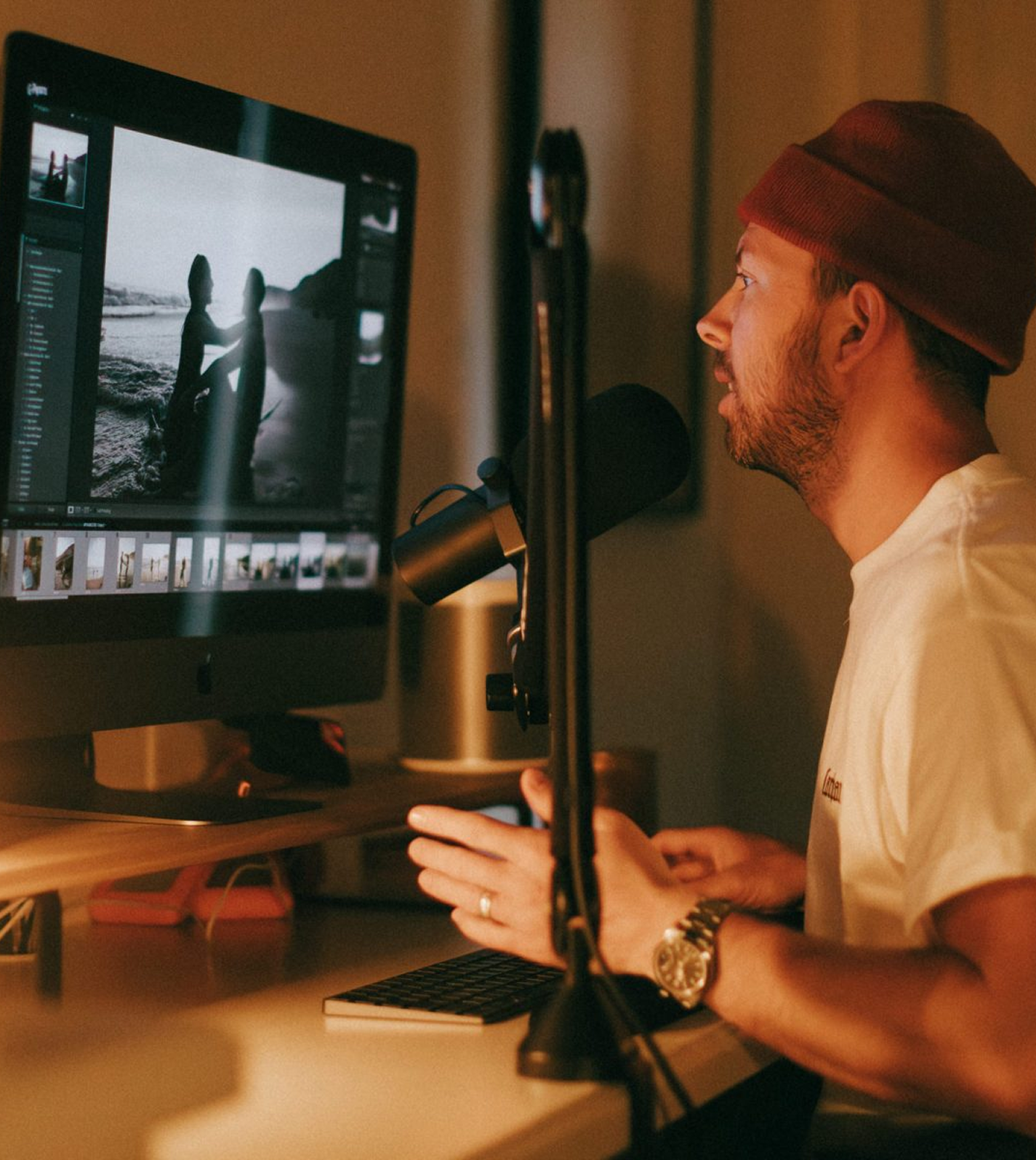 Photographer editing a portrait in Lightroom at a desktop computer