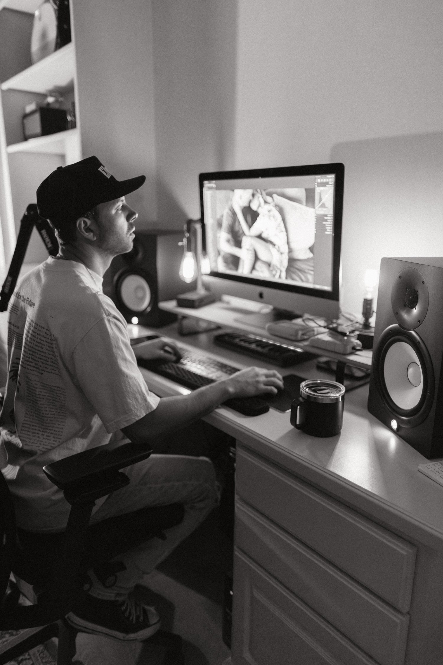 Greg editing in the studio